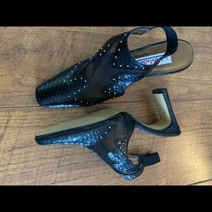 S.t.e.f.a.n.i. Unique stiletto sling back black heels With mini gold studs.